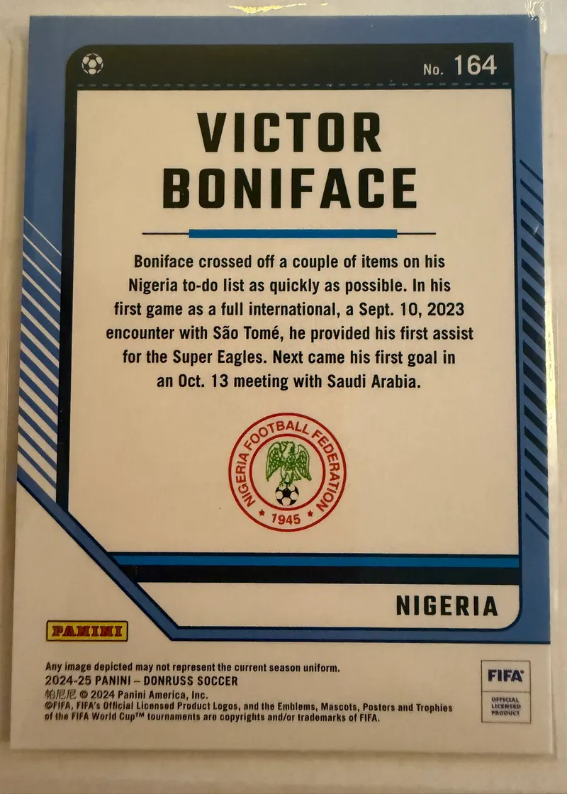 Victor Boniface, Panini Donruss 2024/25 nr 164 — rewers z herbem Nigerii i opisem zawodnika