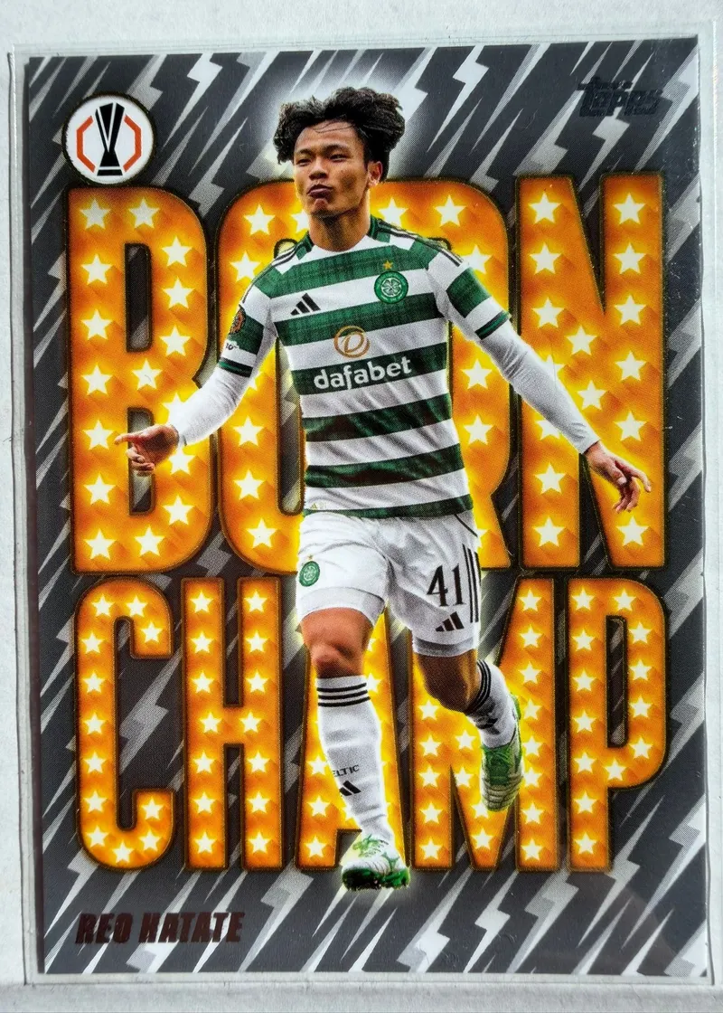 Reo Hatate, Topps UEFA Club Competitions 2025/26 Born Champ, karta BC-14 — awers z wielkim żółtym napisem BORN CHAMP w gwiazdki i piłkarzem w zielono-białych pasach Celtiku
