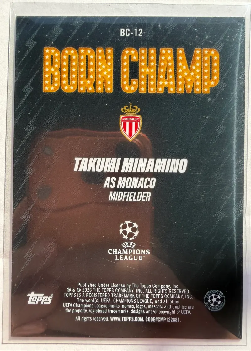 Takumi Minamino, Topps UEFA Club Competitions 2025/26 Born Champ, karta BC-12 — rewers z herbem Monaco, logo Ligi Mistrzów i nazwą podserii